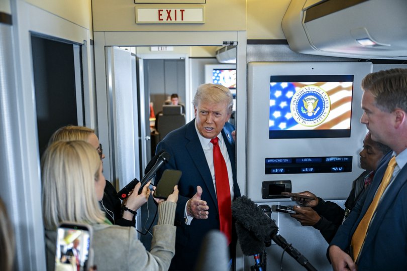 US President Donald Trump talks with reporters aboard Air Force One, while on the way to Israel.