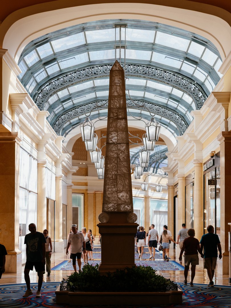 Visitors walk through the shopping mall area of the Bellagio in Las Vegas.