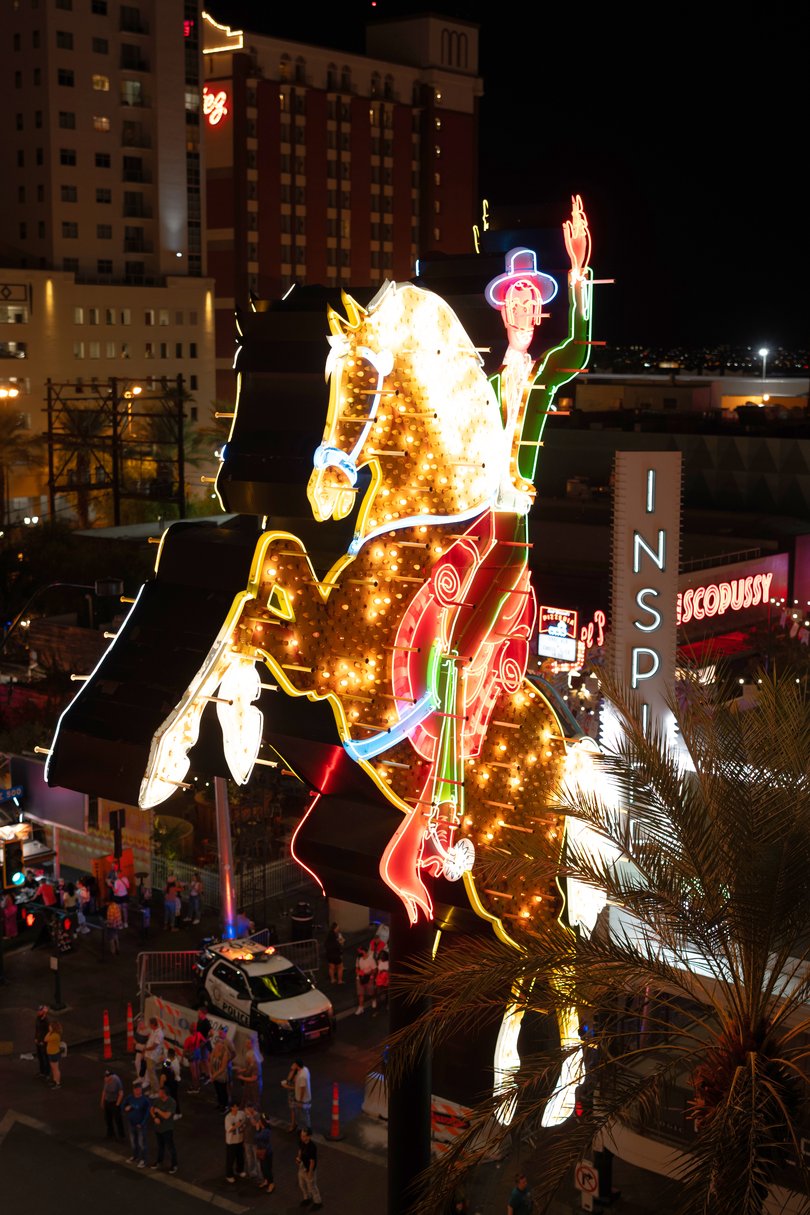 A vintage sign that has been restored lights up East Fremont Street below, in Las Vegas.