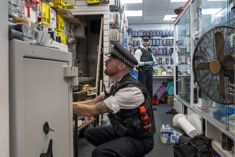 Sgt. Matt Chantry searches a phone shop in north London, September 25, 2025.