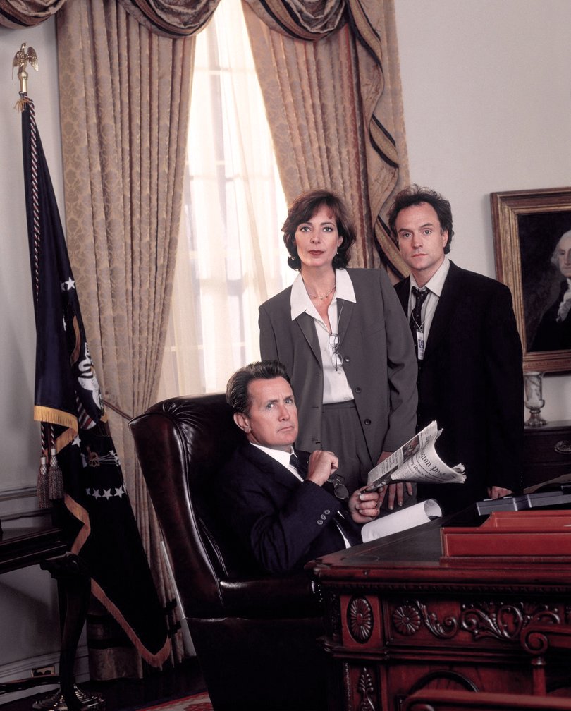 Allison Janney and Bradley Whitford with Martin Sheen on the first season of The West Wing.