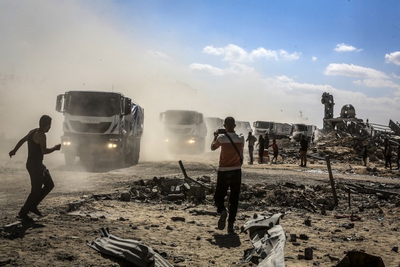 Trucks carrying humanitarian aid and fuel enter Khan Yunis through the Karem Shalom crossing as part of the ceasefire agreement between Israel and Hamas.