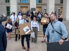 Members of the Pentagon press gallery leave the building after handing in their press credentials. 