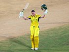 Alyssa Healy of Australia celebrates her century.