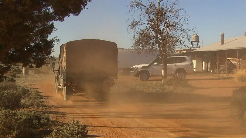 Police and defence force personnel have returned to his family's property to search an expanded zone. Picture: 7NEWS