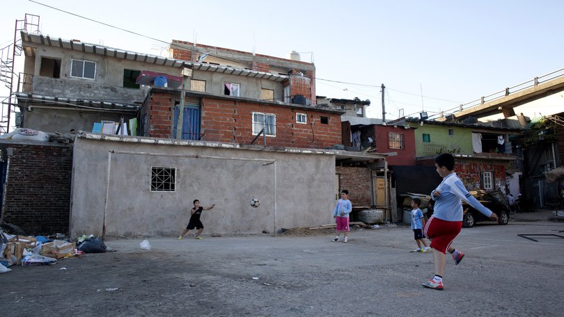 Boys play soccer in the Villa 31 neighbourhood of Buenos Aires, Argentina.