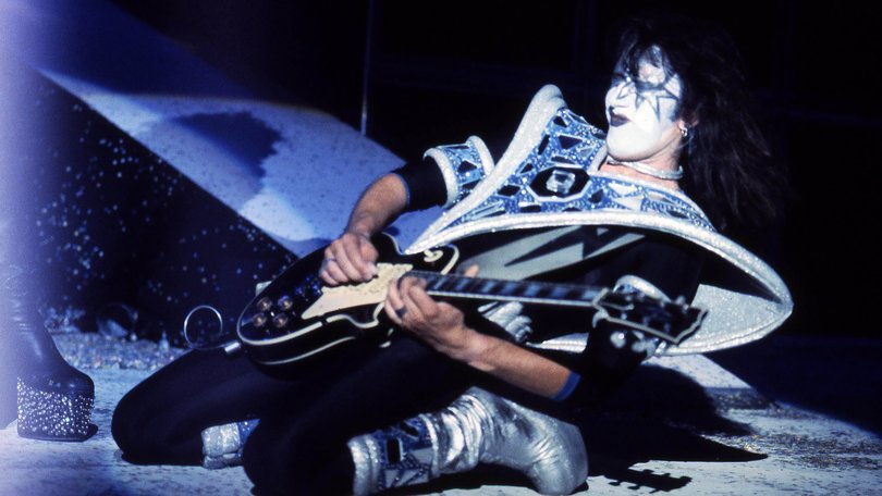 Ace Frehley performing live on stage with Kiss.