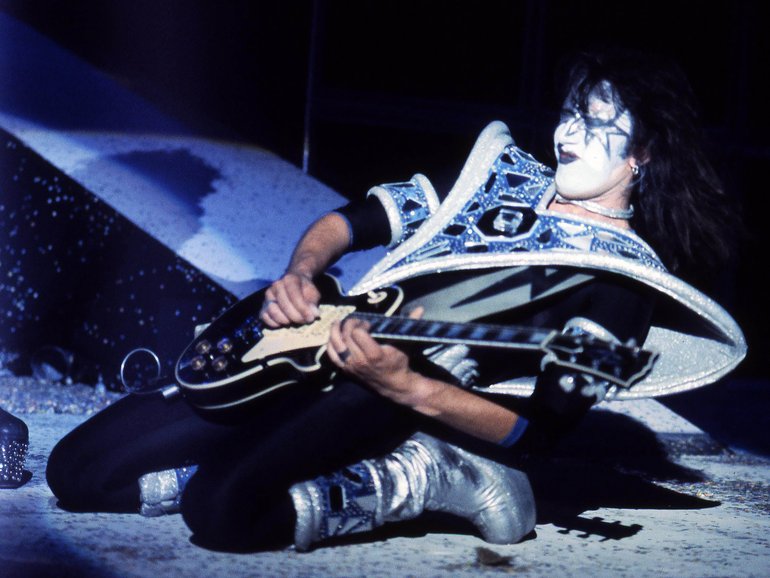 Ace Frehley performing live on stage with Kiss.