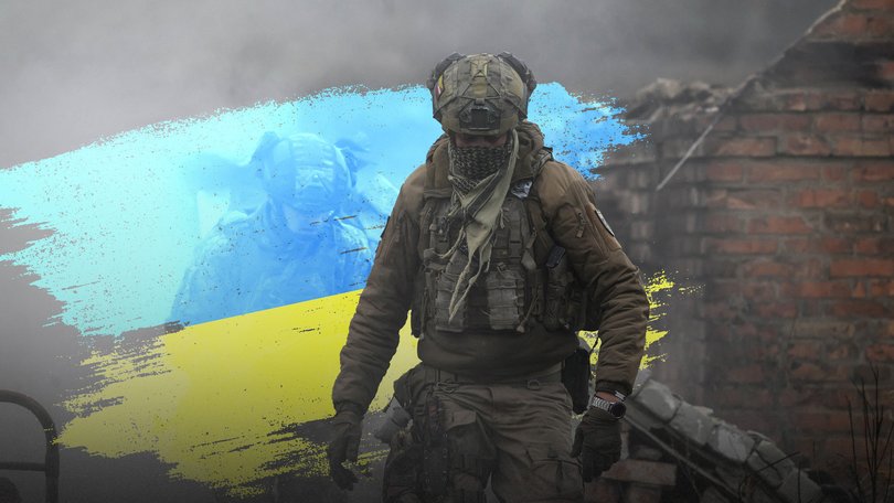 Infantry recruits of the 28th Seperate Mechanized Brigade take cover from a grenade blast as they undergo a basic training course at an undislosed location in eastern Ukraine on October 11, 2025. (Photo by Ed JONES / AFP)
