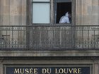 Brazen thieves used a crane to break a window when they robbed jewelry from the Louvre in Paris. (AP PHOTO)