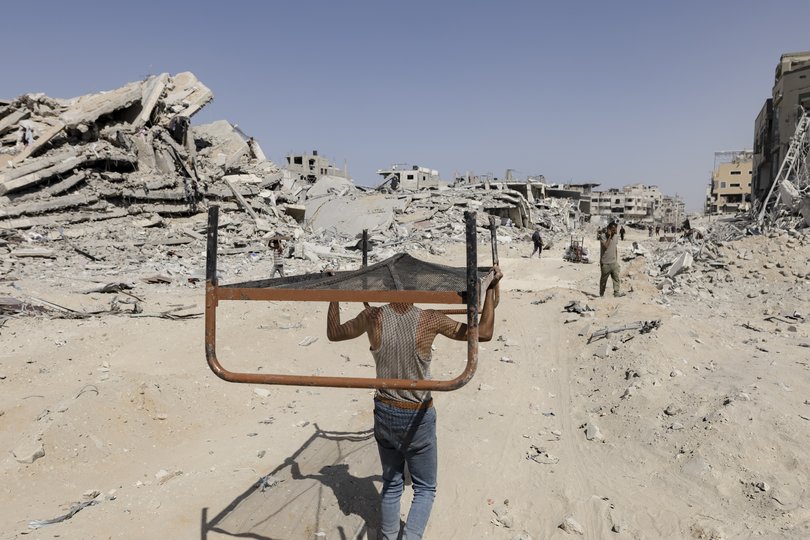 Palestinians salvage furniture from destroyed homes around Gaza City, Gaza Strip, Oct. 11, 2025.