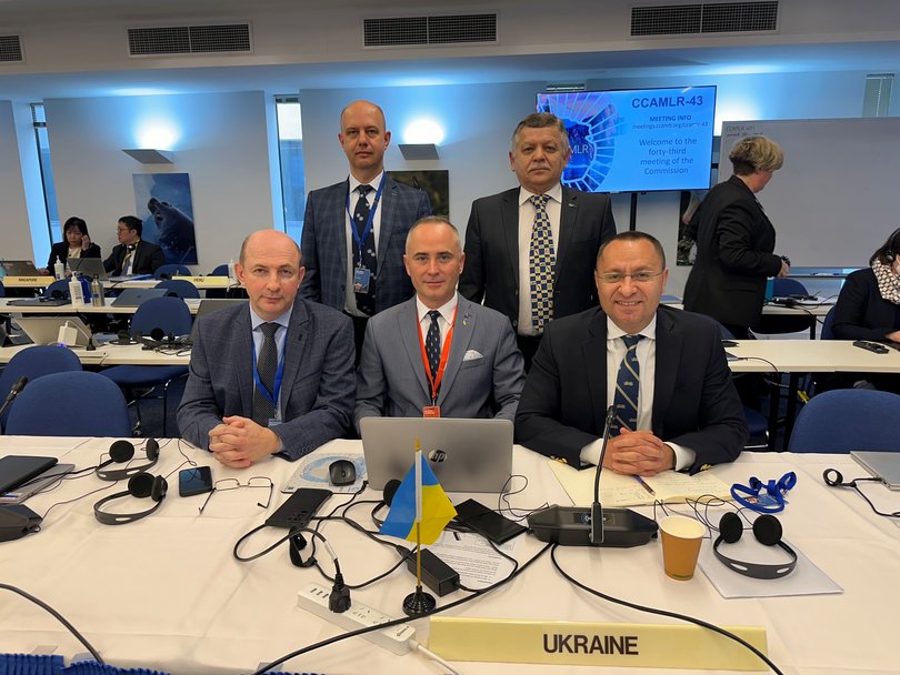 Detained Ukrainian scientist Leonid Pshenichnikov (back right) with other members of the Ukrainian CCAMLR delegation in Hobart last year including Ambassador Vasyl Myroshnychenko (front right).