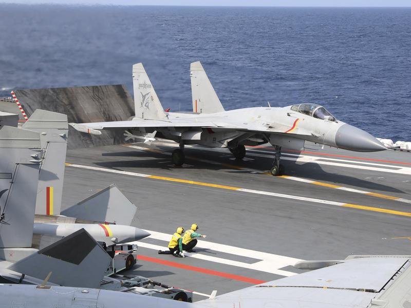 China claims it used naval and air forces to ‘expel’ a Royal Australian Air Force surveillance plane.