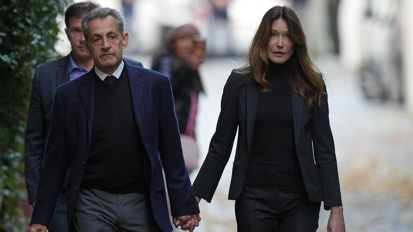 Former French president Nicolas Sarkozy left his home with wife Carla Bruni to attend prison. (AP PHOTO)