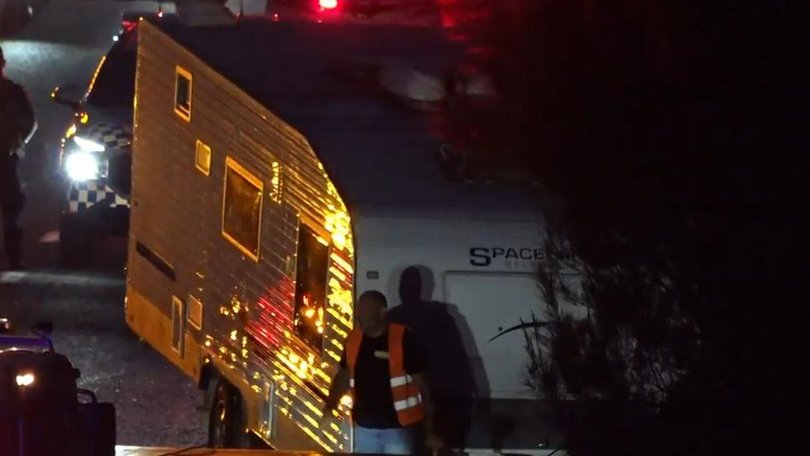 A mother has rescued three children from inside a caravan that had crashed after being stolen.