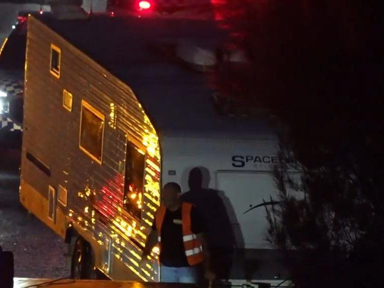 A mother has rescued three children from inside a caravan that had crashed after being stolen.