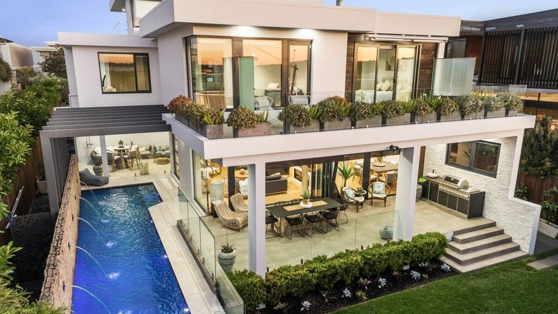 The property is a modern coastal home only moments away from the beach. Pic: Ray White.