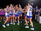 Ash Riddell of the Kangaroos embraces Jasmine Garner after last year’s grand final.