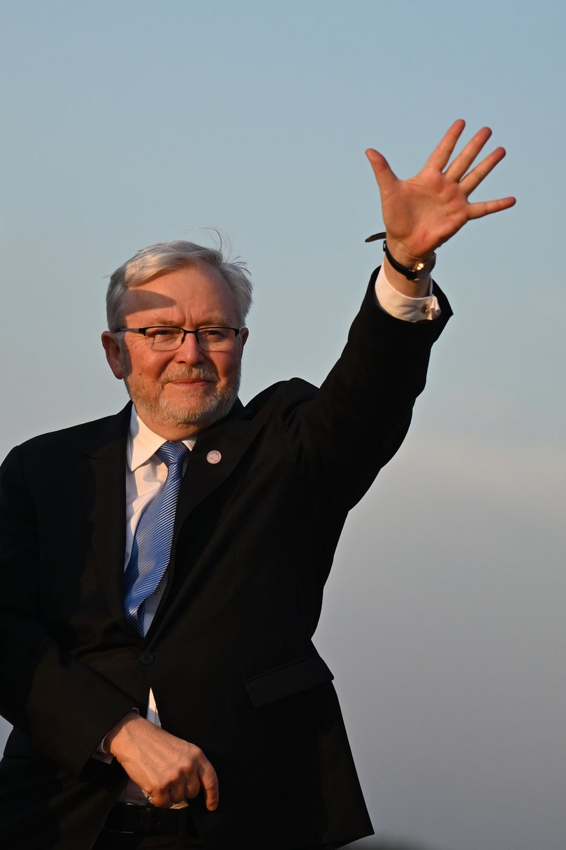 Kevin Rudd waves ahead of Anthony Albanese boarding a plane on departure at Joint Base Andrews in Maryland, United States, Tuesday, October 21, 2025.