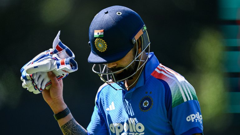 Virat Kohli of India leaves the ground after getting out.
