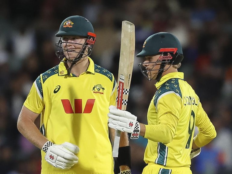 Cooper Connolly acknowledges his 50 alongside fellow matchwinner Mitch Owen at Adelaide Oval. (Matt Turner/AAP PHOTOS)