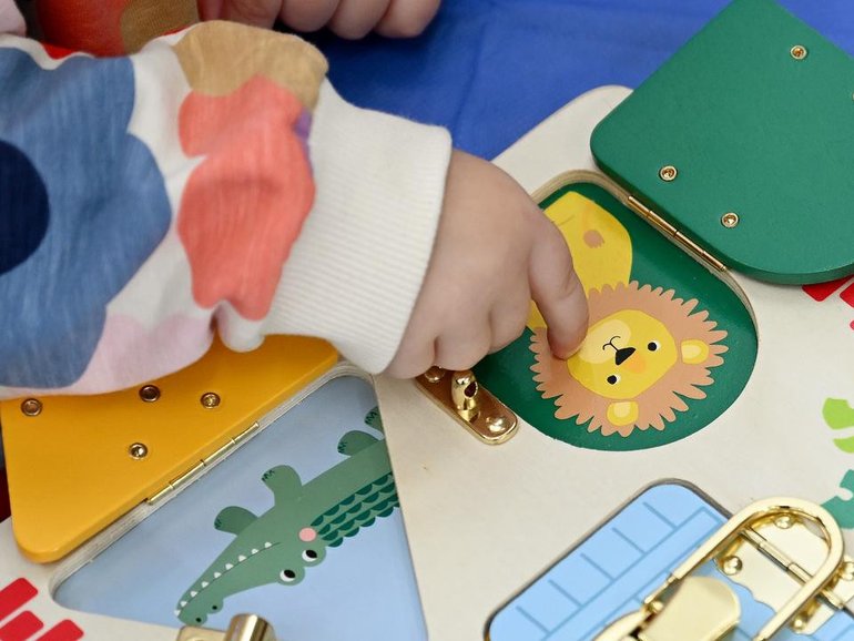 Police say the 28-year-old woman assaulted the same toddler a number of times.