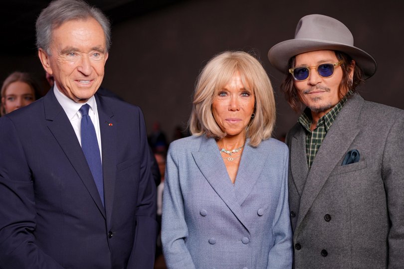 Bernard Arnault, Brigitte Macron, Johnny Depp at the Christian Dior fashion show in October.
