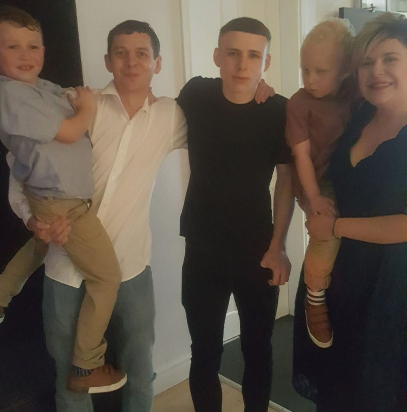 Left to right is brother William, dad Daniel, brother Luke, Oliver and mum Clare.