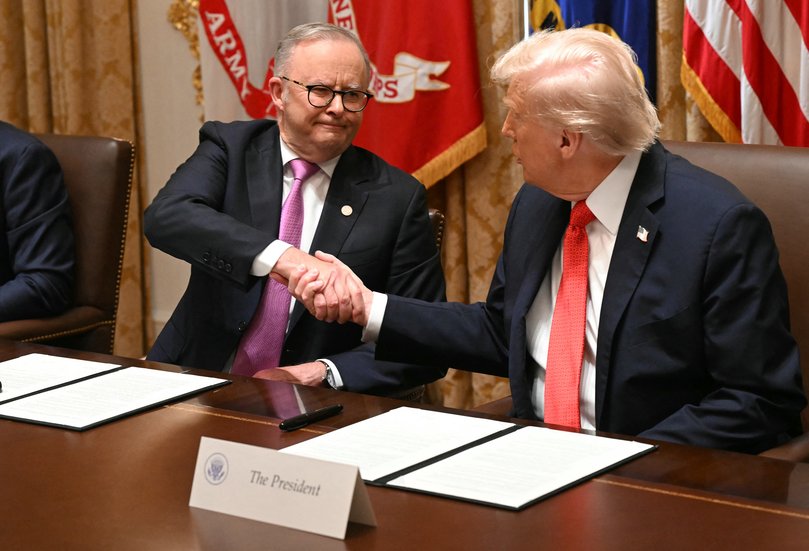 US President Donald Trump and Australia's Prime Minister Anthony Albanese shake hands after signing a document on critical minerals in the Cabinet Room at the White House.