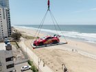 Frank Developments lifted a Porsche race car into the skyline to celebrate its latest luxury project. Photo supplied
