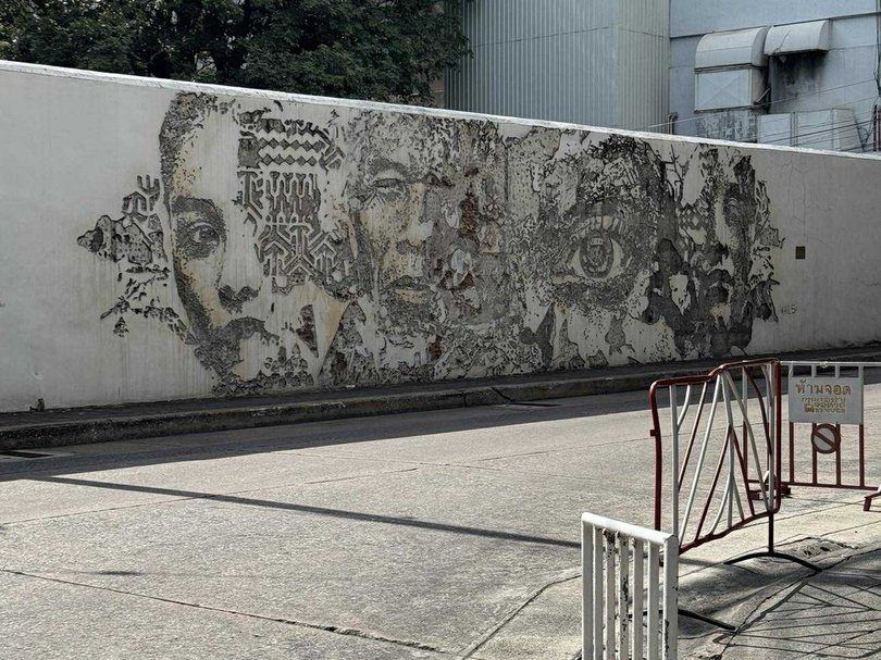 Portuguese street artist Vhils has intricately carved the wall of the Portuguese Embassy in Talat Noi.