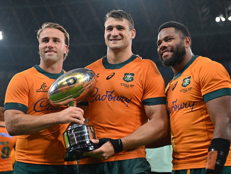 TOKYO, JAPAN - OCTOBER 25: (L-R) Hamish Stewart, Nick Champion De Crespigny and Filipo Daugunu of Australia pose with the trophy after 19-15 victory in the rugby international test between Japan and Australia at National Stadium on October 25, 2025 in Sendai, Japan. (Photo by Kenta Harada/Getty Images)