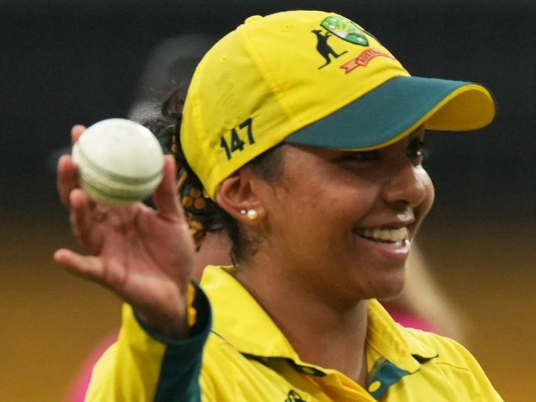 Australia's Alana King raises the ball to the crowd after her record seven-wicket World Cup haul. 
