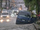 A tropical storm wreaking havoc in the Dominican Republic and Haiti is intensifying. (AP PHOTO)