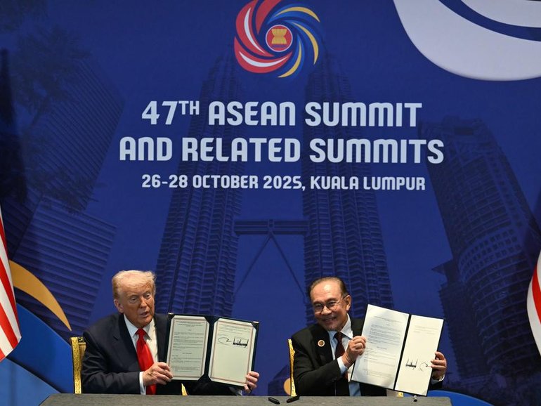 Malaysian Prime Minister Anwar Ibrahim and US President Donald Trump have signed deals. (AP PHOTO)