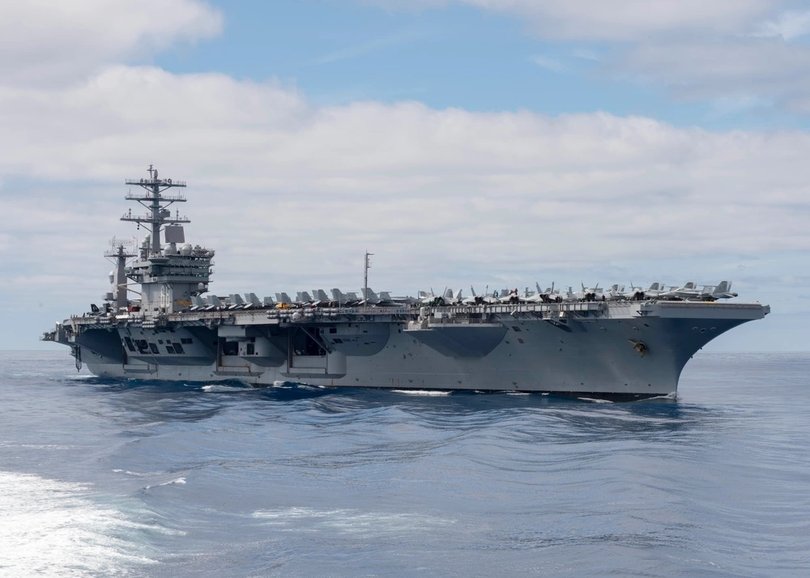 The aircraft are attached to the USS Nimitz.