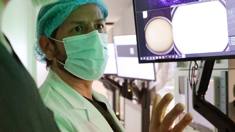 Alejandro Chávez-Badiola at the Hope IVF clinic alongside an AI and robotic system that automates 205 manual steps of IVF.