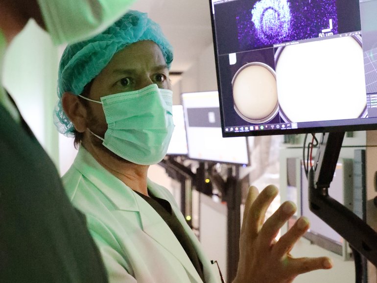 Alejandro Chávez-Badiola at the Hope IVF clinic alongside an AI and robotic system that automates 205 manual steps of IVF.