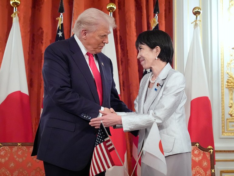 President Donald Trump, left, and Japan's Prime Minister Sanae Takaichi shake hands during a signing ceremony at Akasaka Palace in Tokyo.