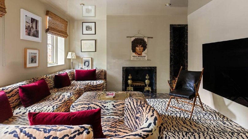 The tiger print lounge room. Pic: Compass.