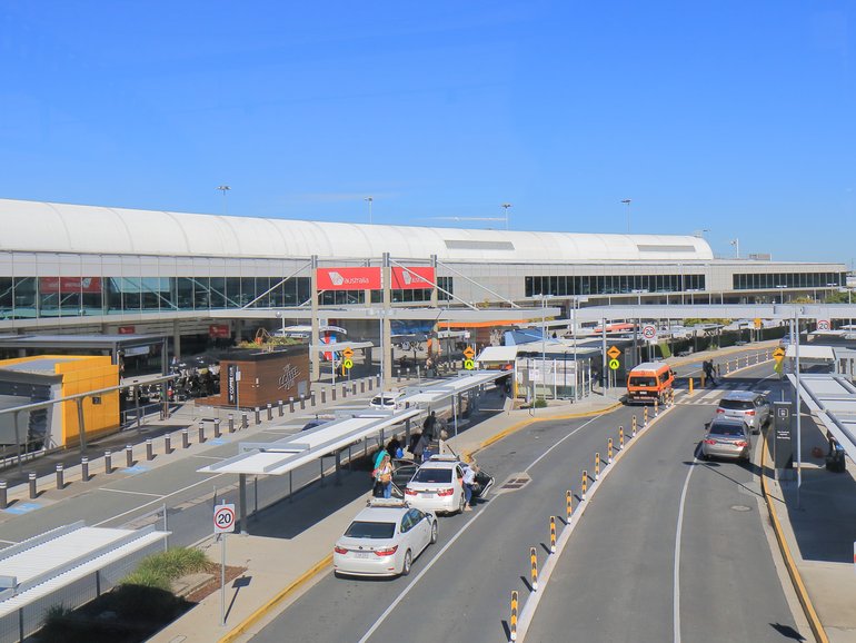 A Brisbane mother and her baby have been left sweltering at the airport after three taxis allegedly refused to take them.