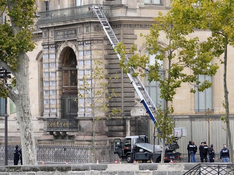 Thieves pretending to be maintenance workers used a truck and basket lift to break into the Louvre. (AP PHOTO)