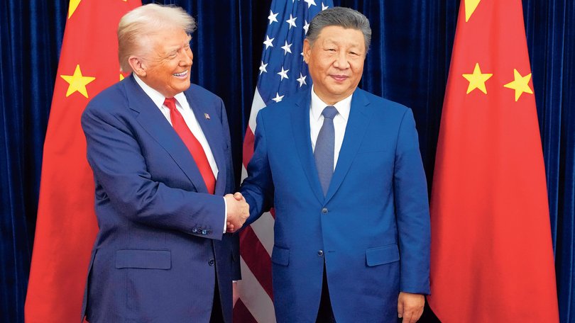 Donald Trump greets Xi Jinping ahead of a bilateral meeting at Gimhae Air Base on October 30, 2025 in Busan.