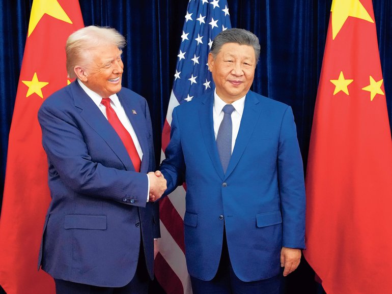 Donald Trump greets Xi Jinping ahead of a bilateral meeting at Gimhae Air Base on October 30, 2025 in Busan.