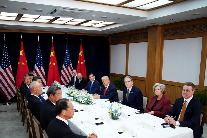 U.S. President Donald Trump (C) and Chinese President Xi Jinping attend a bilateral meeting at Gimhae Air Base on October 30, 2025 in Busan, South Korea.