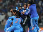 Jemimah Rodrigues and  Amanjot Kaur of India celebrate with teammates following victory in the ICC Women's Cricket World Cup India 2025 semifinal.