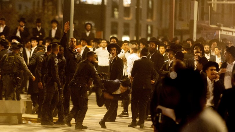 Thousands of Ultra-Orthodox Jewish men hold a massive anti-draft rally.