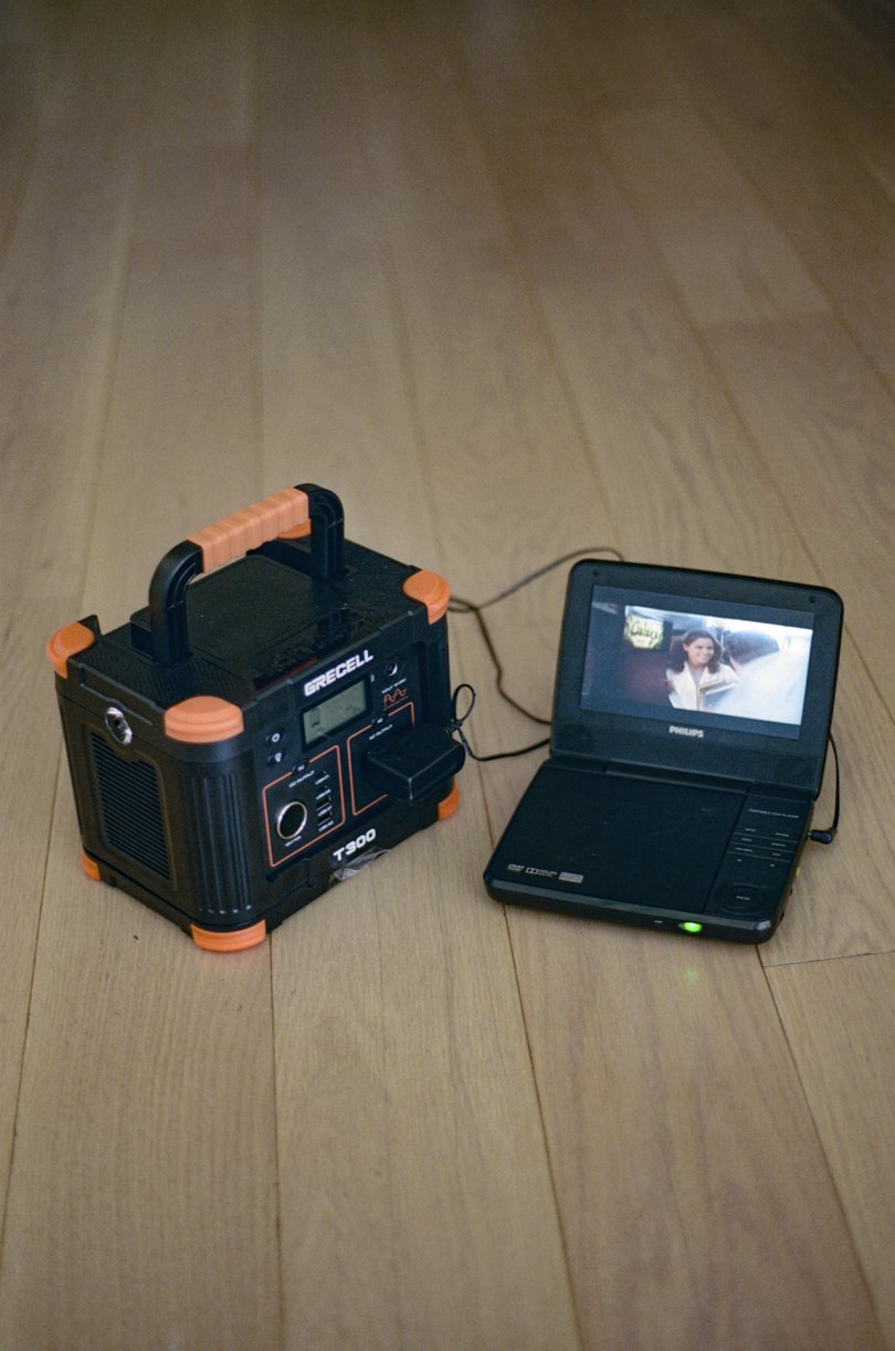 A portable solar generator powers a DVD player in New York, Sept. 29, 2025. 