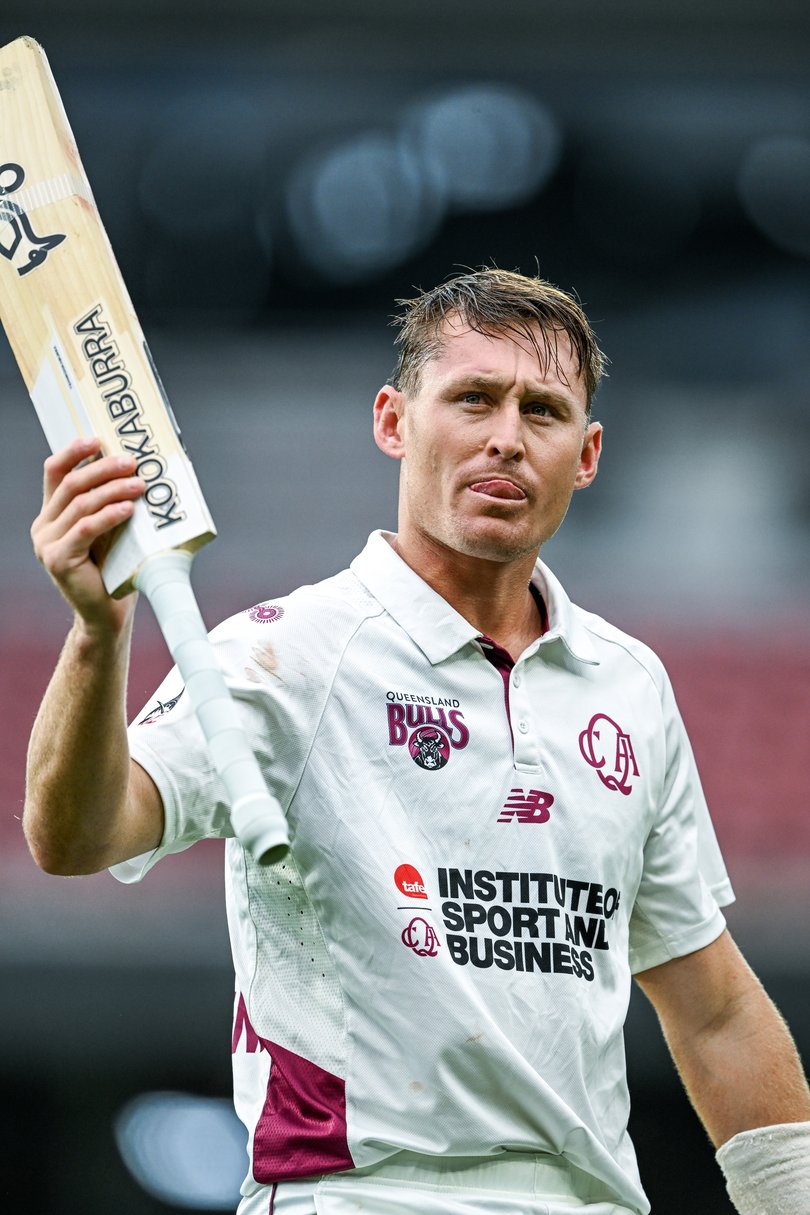 Marnus Labuschagne of the Queensland Bulls raises his bat.