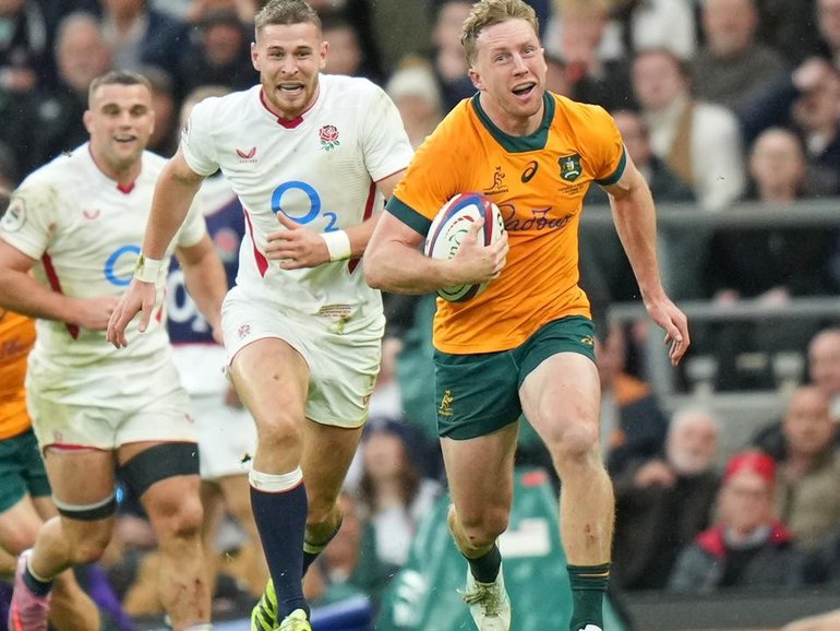 Harry Potter offers a rare smile for the Wallabies as he speeds over for their only try. (AP PHOTO)